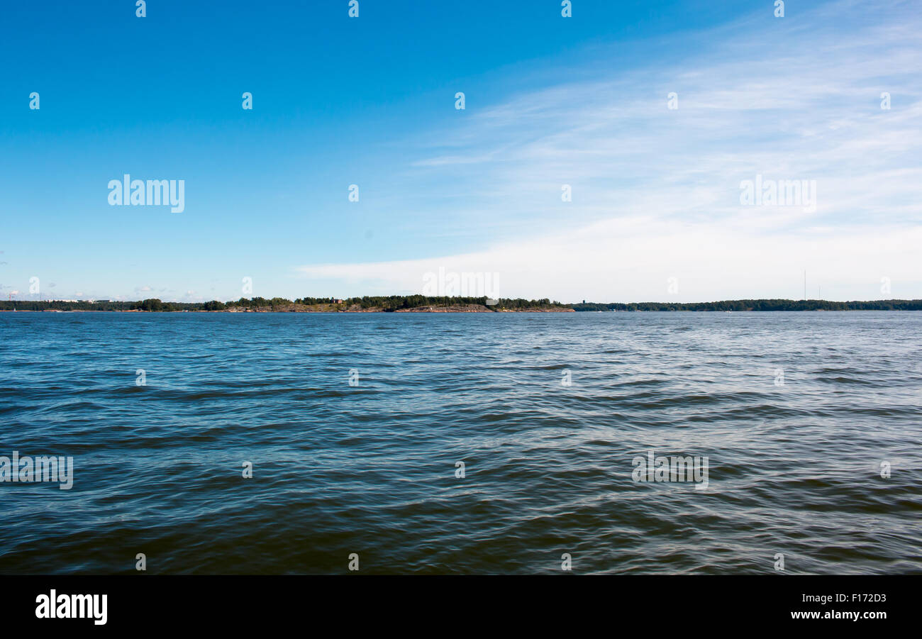 Coastline of Helsinki city during sunny summer day. Deep blue sky. Stock Photo