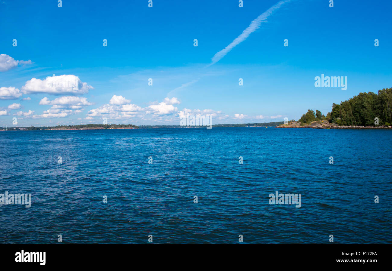 Coastline of Helsinki city during sunny summer day. Deep blue sky. Stock Photo