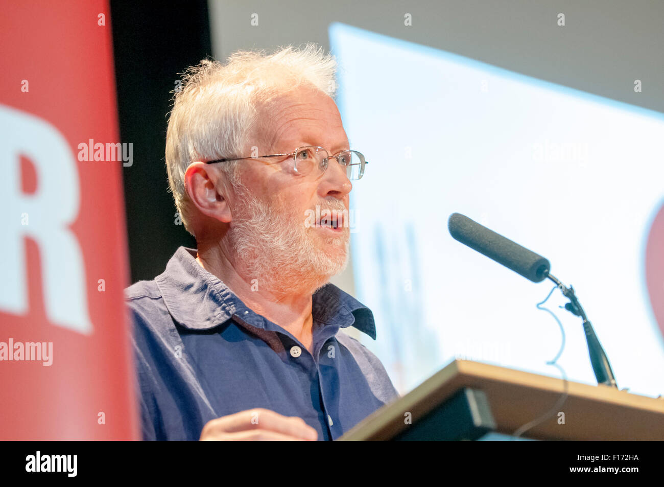 Exeter, UK. 28th Aug, 2015. County Councillor Priory & St Leonard’s. Andy Hannan, address the auience during the Jeremy Corbyn rally in Exeter in front of 500 supporters at the Exeter Corn Exchange Credit:  Clive Chilvers/Alamy Live News Stock Photo