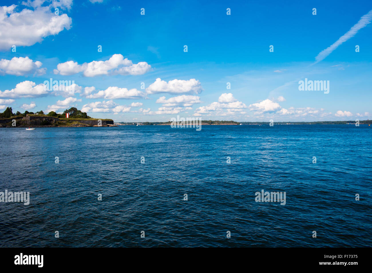 Coastline of Helsinki city during sunny summer day. Deep blue sky. Stock Photo