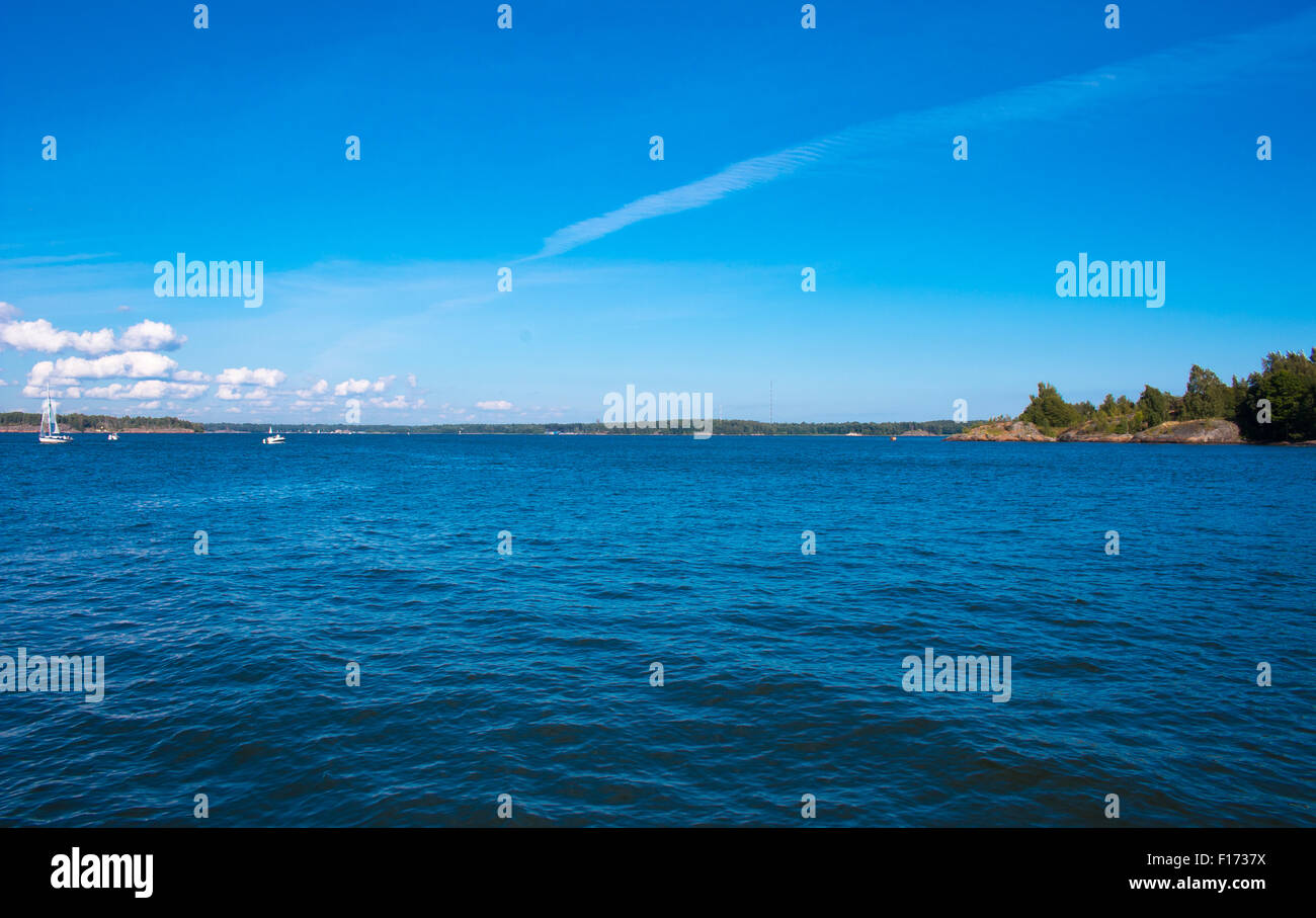 Coastline of Helsinki city during sunny summer day. Deep blue sky. Stock Photo