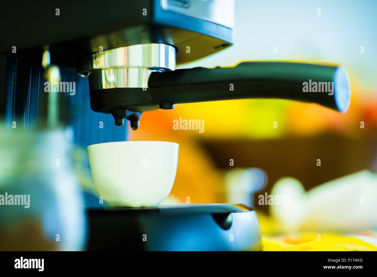 Small Espresso Machine in Work. Making Delicious Cappuccino Coffee. Stock Photo