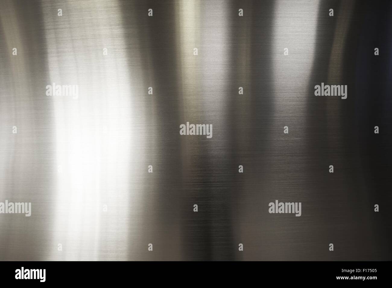 Polished Metal Plate Background with Light Reflections. Stock Photo