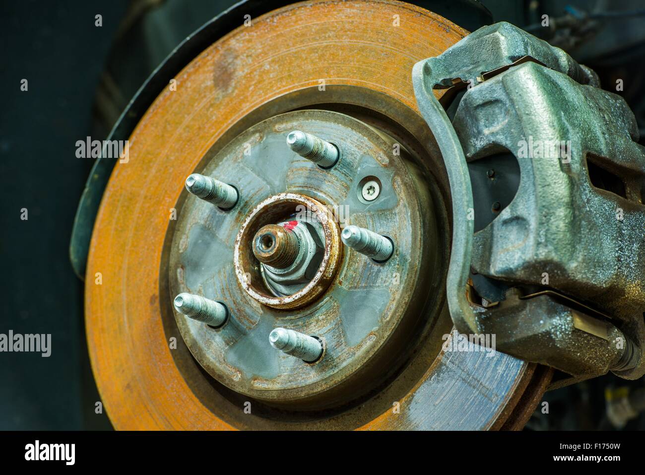 Rusty Car Disc Brake Closeup Photo. Servicing Car Brakes. Stock Photo