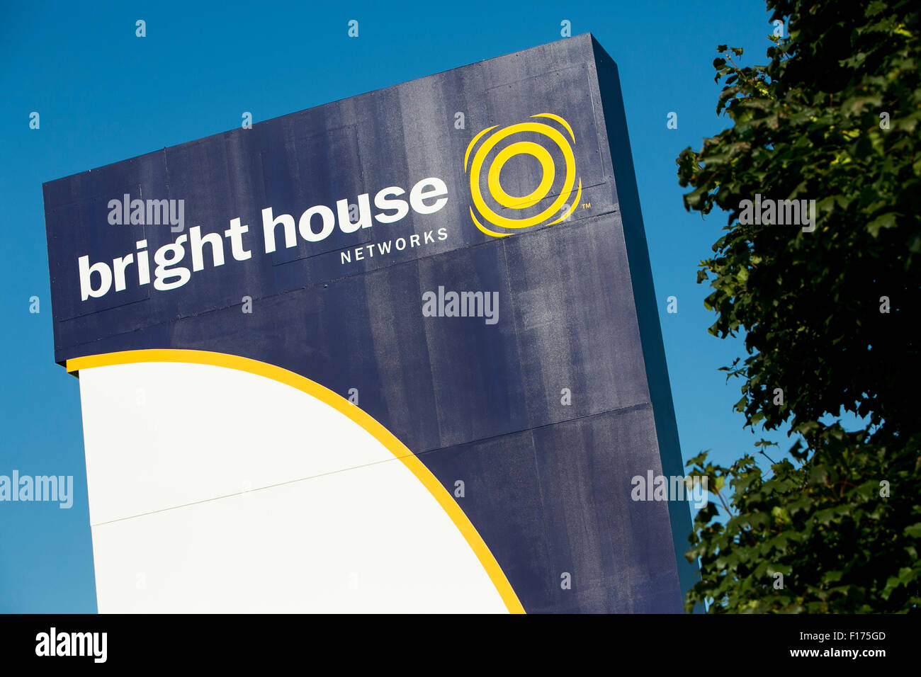 A logo sign outside of a facility occupied by Bright House Networks in Indianapolis, Indiana on August 15, 2015. Stock Photo