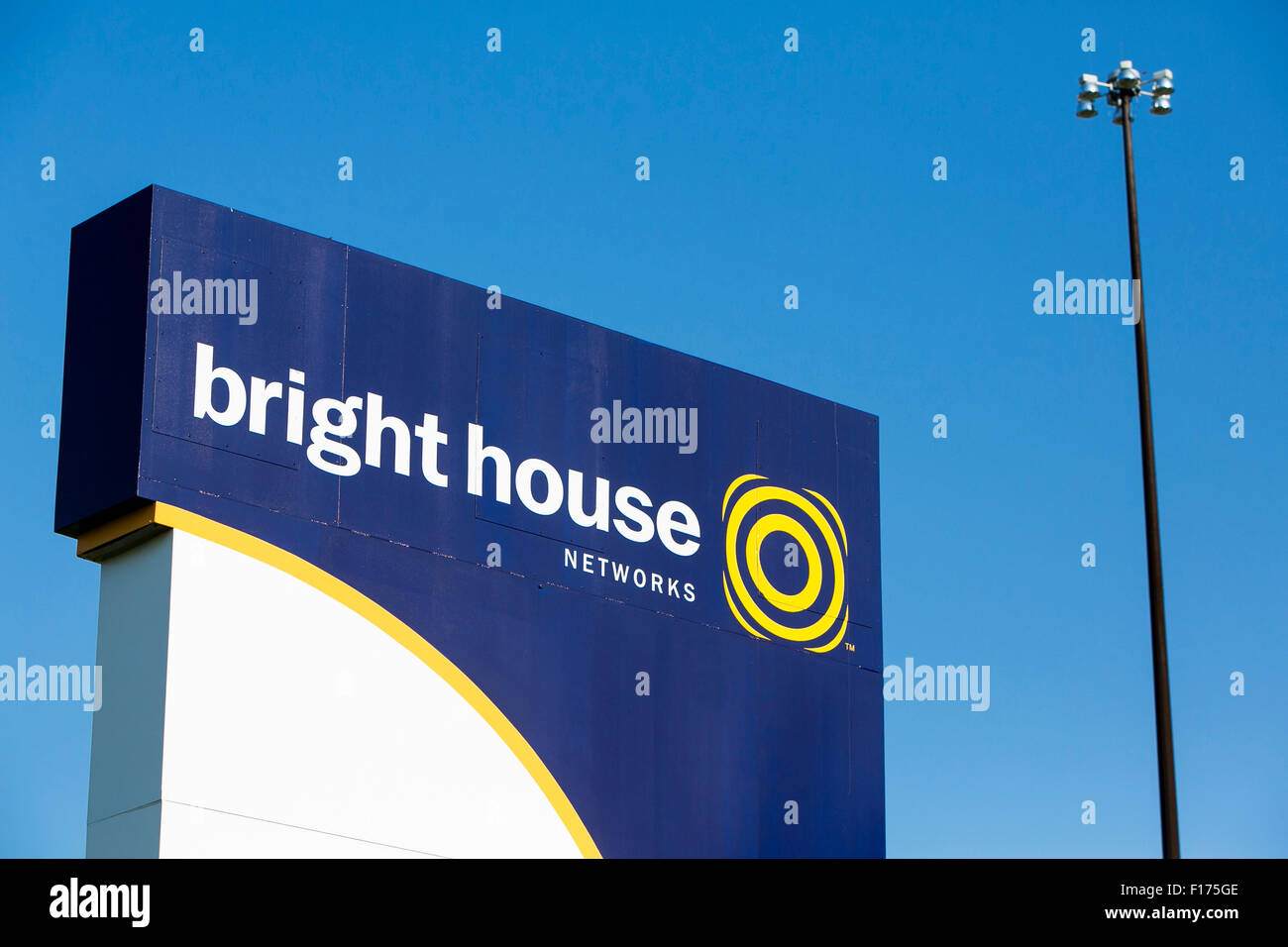 A logo sign outside of a facility occupied by Bright House Networks in Indianapolis, Indiana on August 15, 2015. Stock Photo