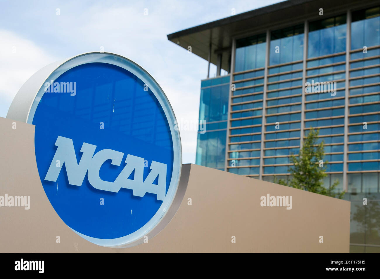 A logo sign outside of the headquarters of the National Collegiate Athletic Association (NCAA) in Indianapolis, Indiana on Augus Stock Photo