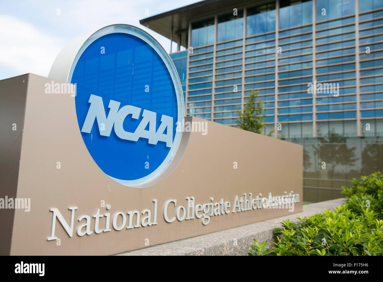 A logo sign outside of the headquarters of the National Collegiate