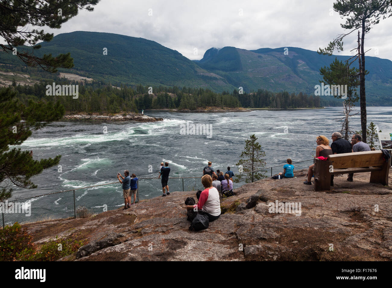 Tourists watching the ebb tide flow at Skookumchuck Narrows near Egmont