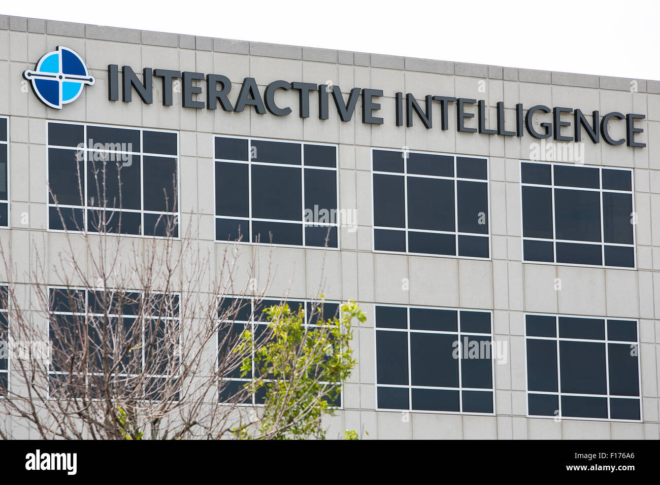 A logo sign outside of the headquarters of Interactive Intelligence, Inc., in Indianapolis, Indiana on August 15, 2015. Stock Photo