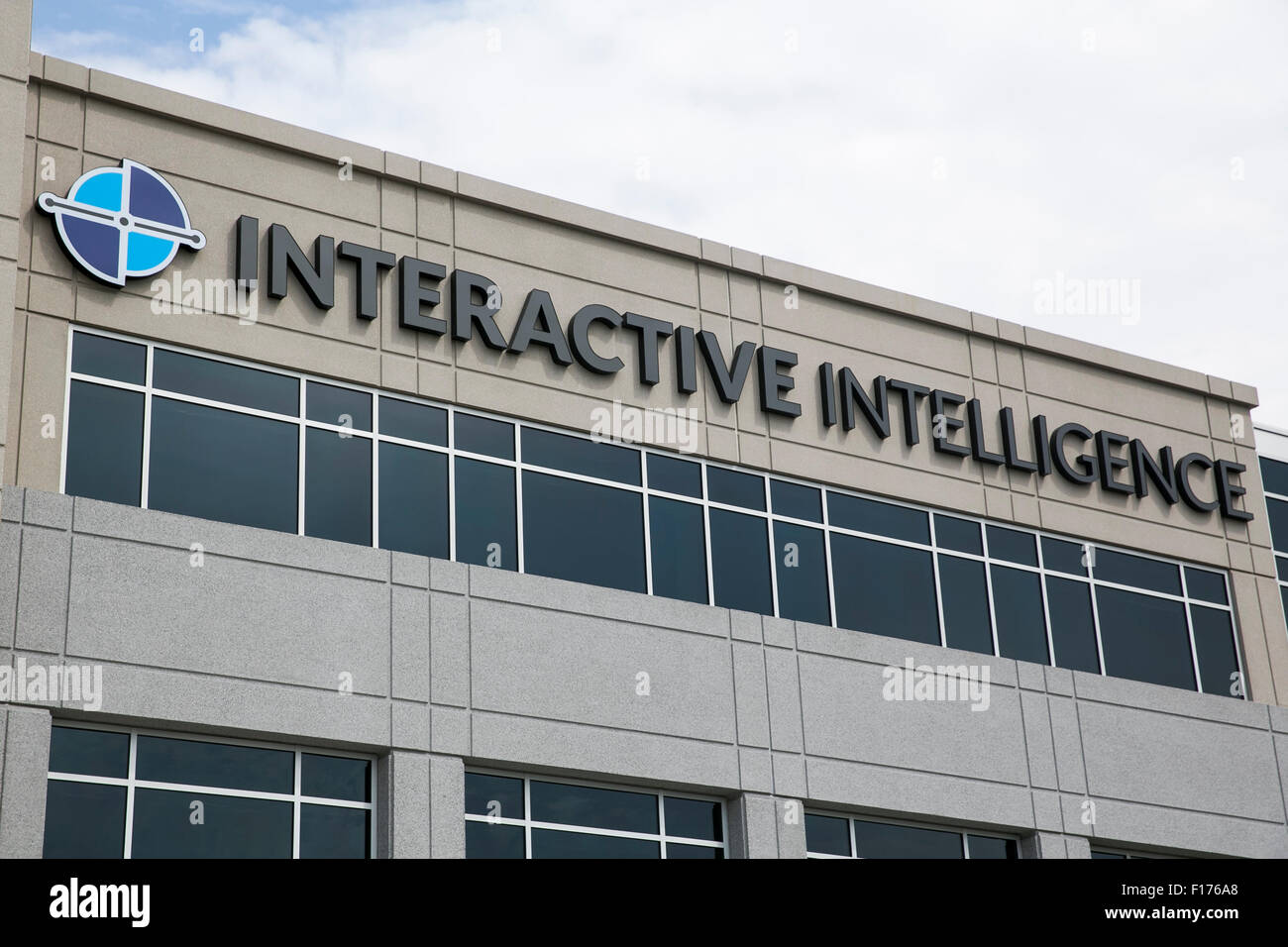 A logo sign outside of the headquarters of Interactive Intelligence, Inc., in Indianapolis, Indiana on August 15, 2015. Stock Photo