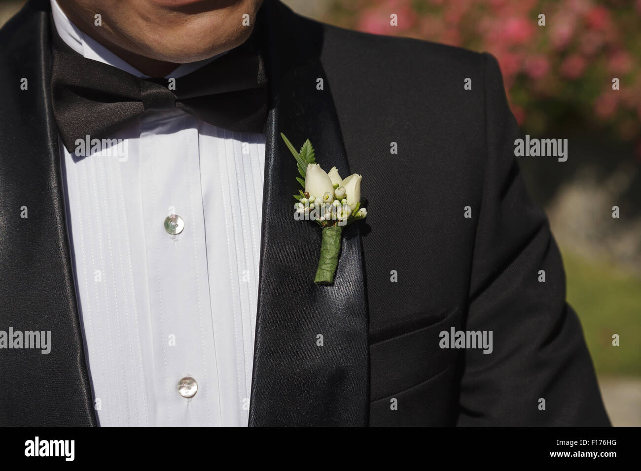Groom with Tuxedo and Wedding Flower Stock Photo