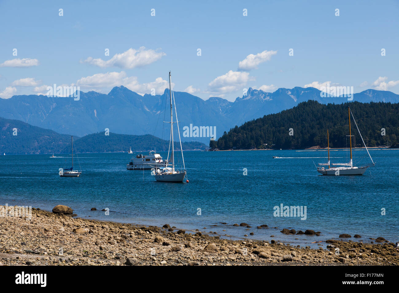 Pleasure boats anchored off the beach in Gibson's Landing on the Sunshine Coast of British Columbia, Stock Photo
