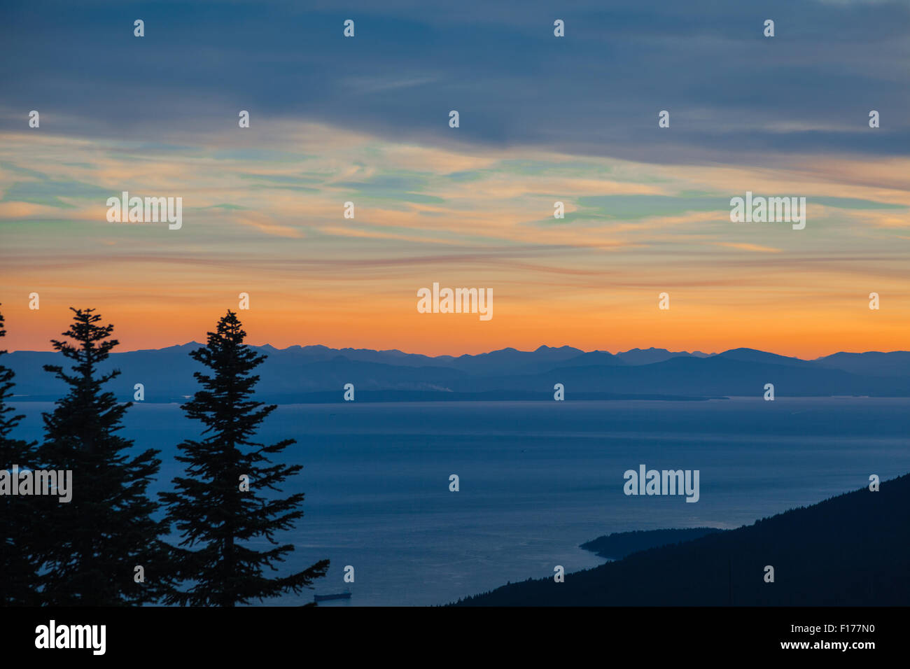 Sunset over Vancouver Island seen from the top of Grouse Mountain in Vancouver, British Columbia Stock Photo