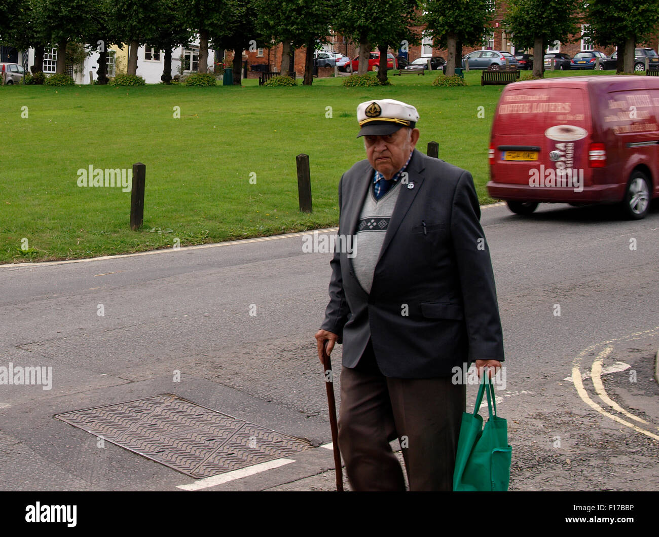 Grumpy looking old man with sailors cap, Marlborough, Wiltshire, UK Stock Photo