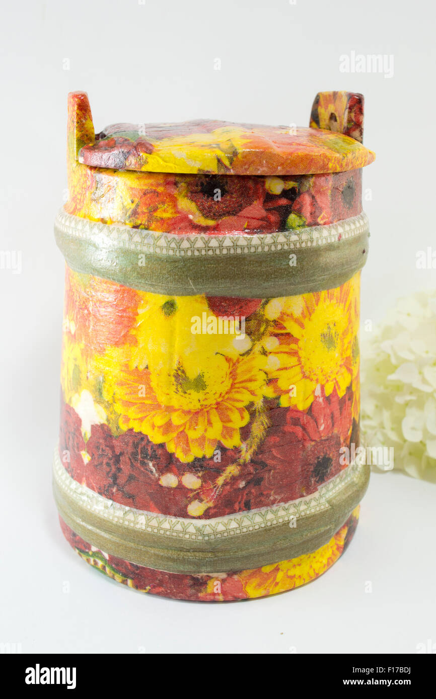 Decoupage decorated flower pattern jar with flowers on white background Stock Photo