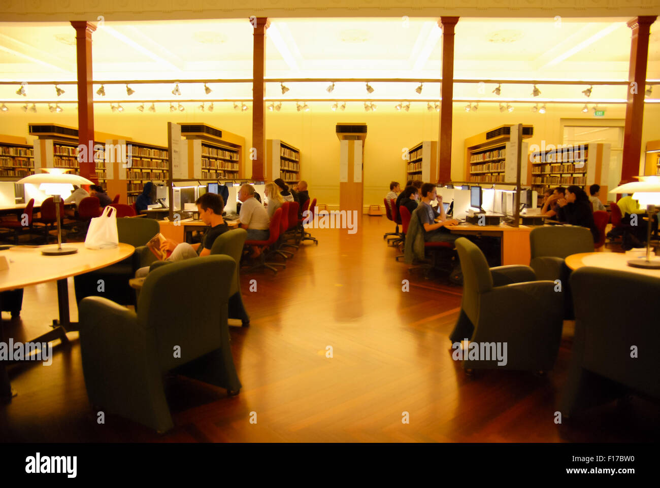 People reading and studying at the State Library of Victoria, Melbourne, Australia. Stock Photo