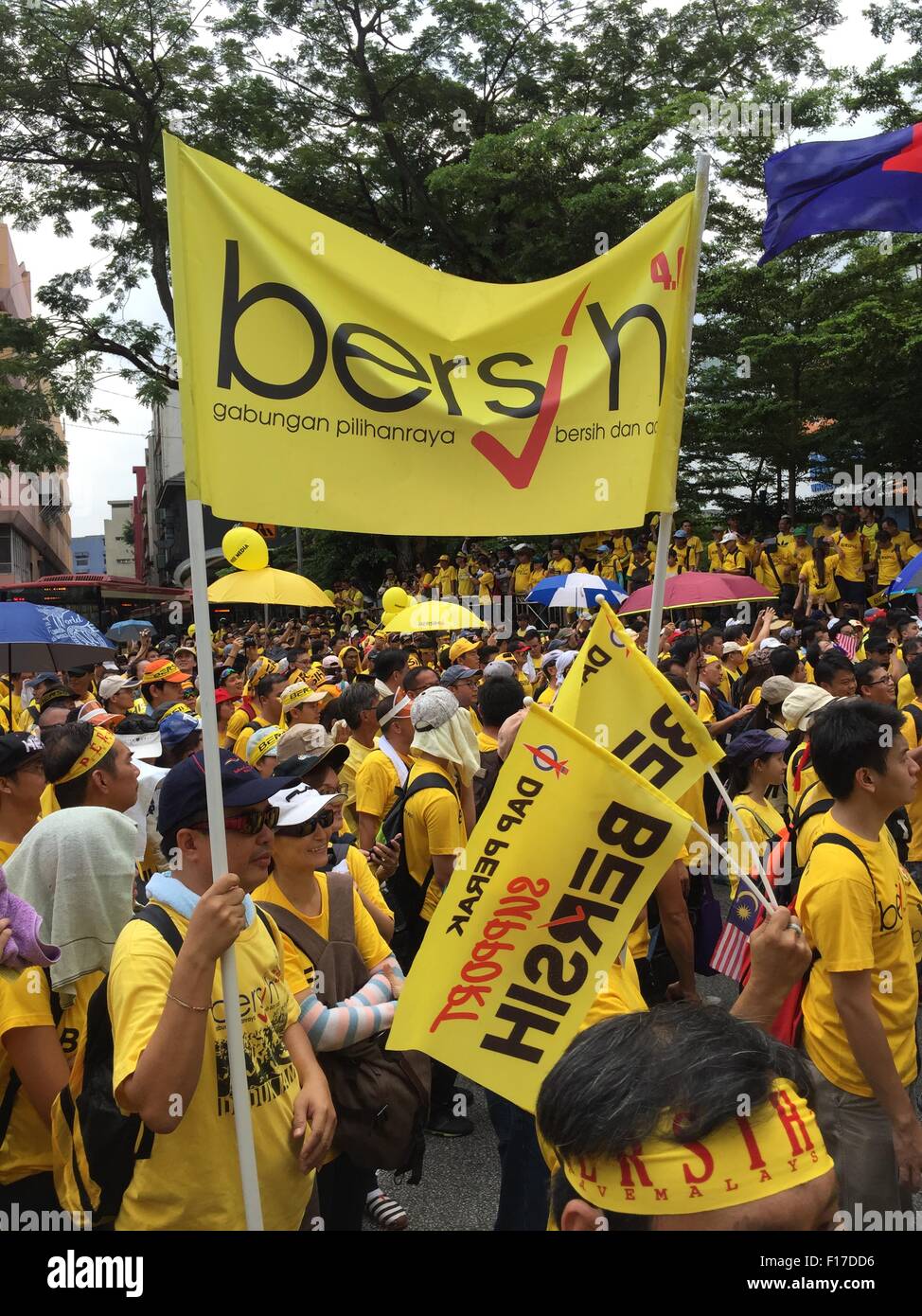 Kuala Lumpur, Malaysia. 29th Aug, 2015. Yellow shirt Supporters carrying Bersih flag supporting Bersih 4 Rally for Free Fair Elections. Bersih has organized Rallies 29 and 30 August 2015 in Major cities around Malaysia Credit:  Chung Jin Mac/Alamy Live News Stock Photo