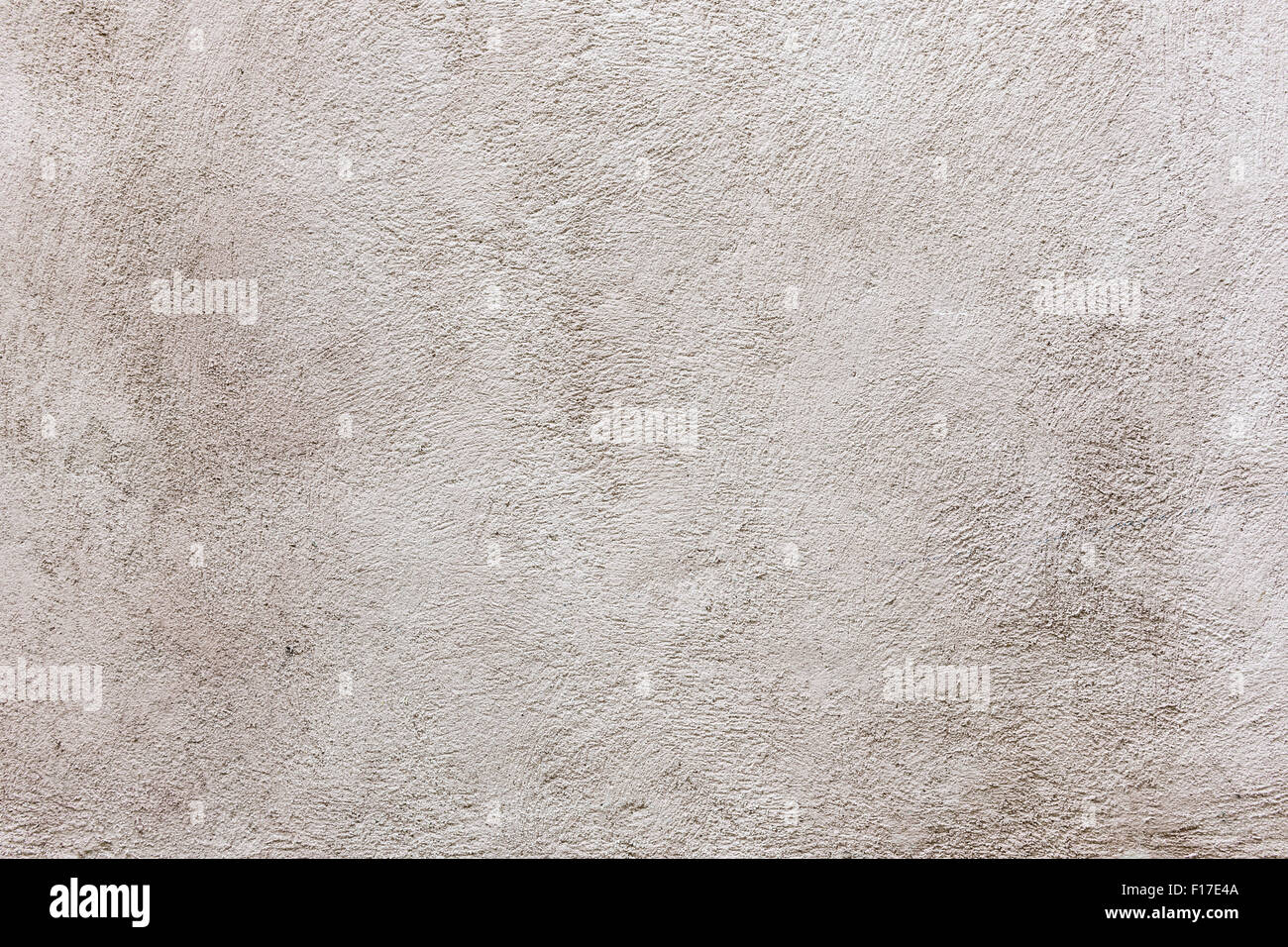 Old vintage plastered stucco wall brushed texture abstract background in neutral color Stock Photo