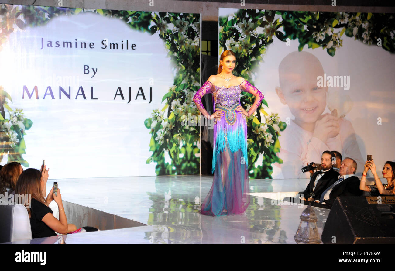 Damascus, Syria. 28th Aug, 2015. A group of Syrian social activists in cooperation with the Syrian government and the Trade Chamber hold a fashion show in Damascus, capital of Syria, on Aug. 28, 2015. The fashion show aims to raise funds for cancer patients who are taken care of by the Basmah Charity for Cancer Patients. Credit:  Ammar/Xinhua/Alamy Live News Stock Photo