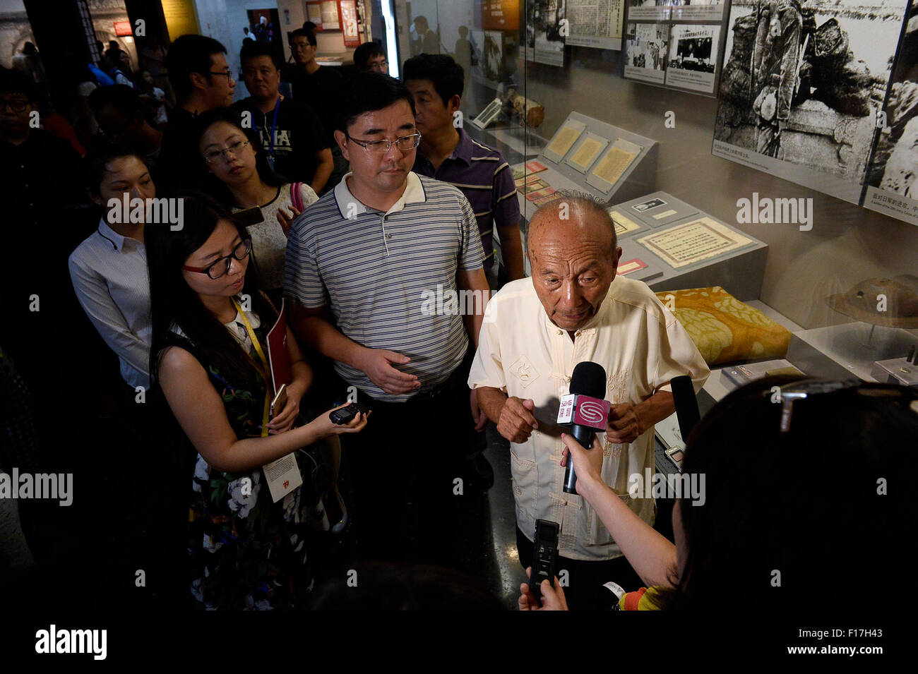 Beijing, Beijing, China. 29th Aug, 2015. Journalists interview Zheng Fulai, a witness of the 1937 July 7 Incident, at the Museum of the War of Chinese People's Resistance Against Japanese Aggression in Wanping, a town that witnessed the beginning of the war, in Beijing, Aug. 29, 2015. More than 40 domestic and international journalists on Saturday visited Wanping town and the Lugouqiao Bridge for the 70th anniversary of the victory of the Chinese People's War of Resistance Against Japanese Aggressions and the World Anti-Fascist War. © Peng Zhaozhi/Xinhua/Alamy Live News Stock Photo