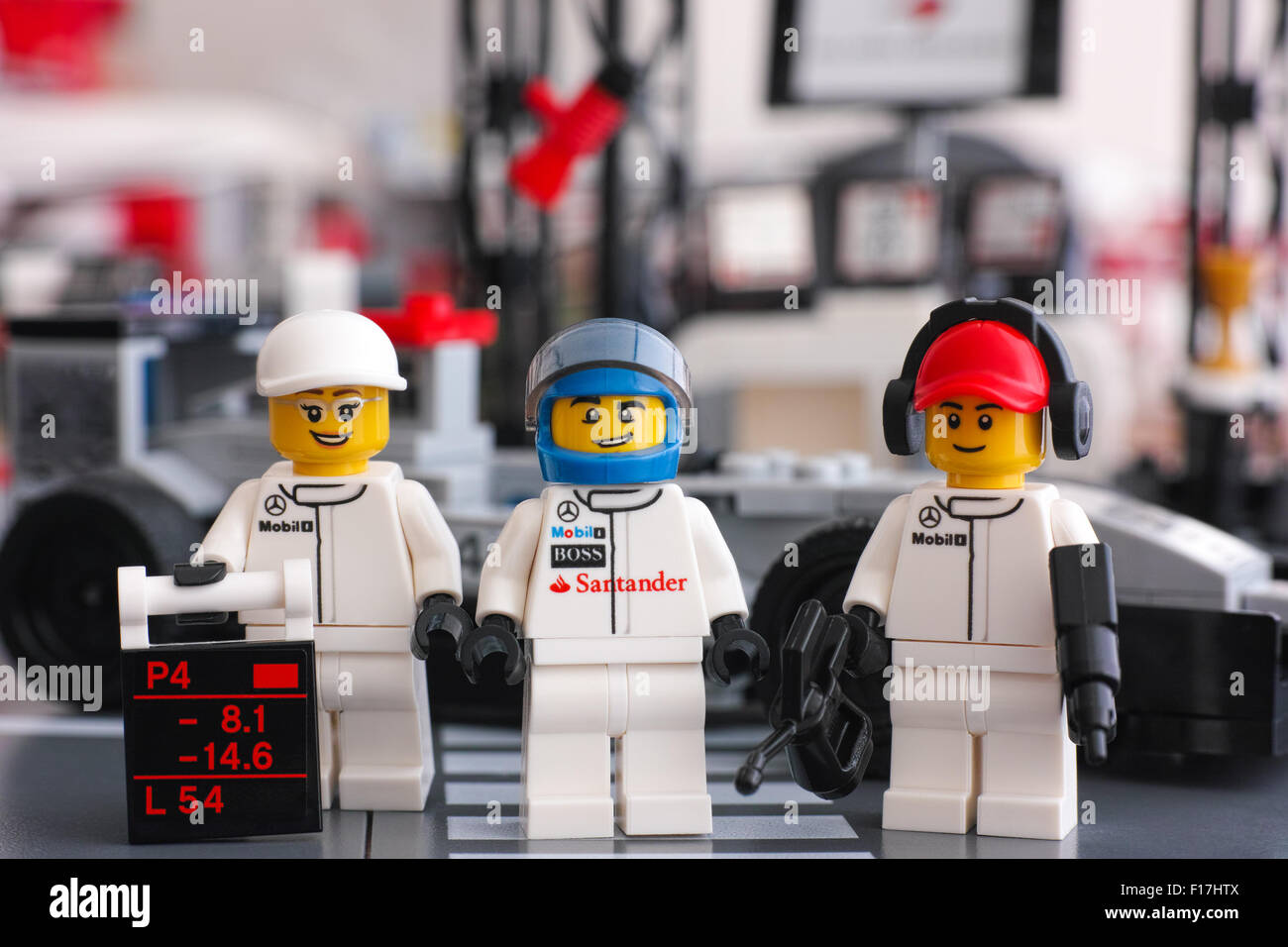 Lego McLaren Mercedes team crew members minifigures by LEGO Speed Champions opposite pit stop. Stock Photo