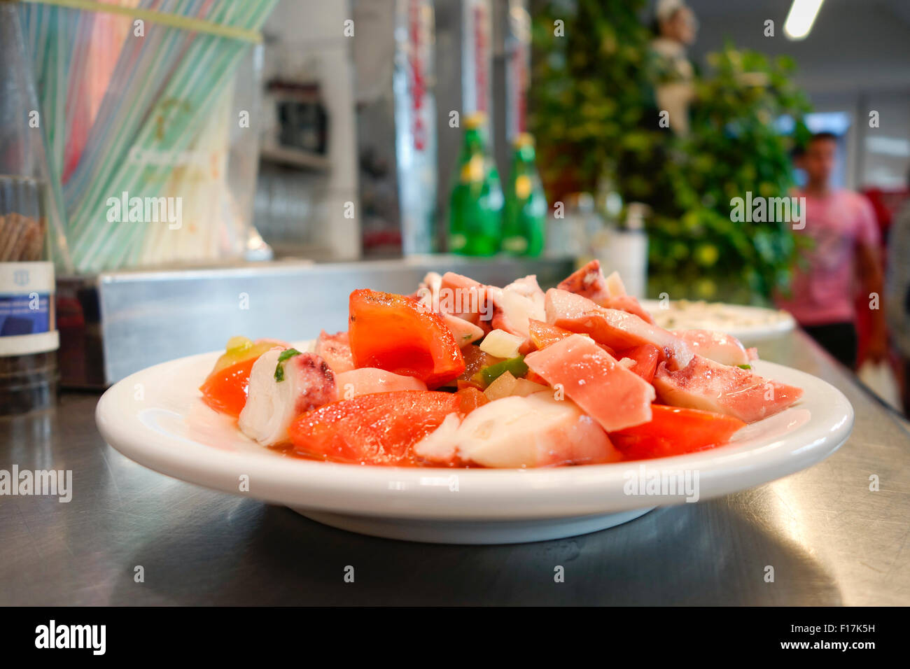 Octopus Salad, Ensalada de pulpo Seafood Salad served on small plate at seafood bar. Spain Stock Photo