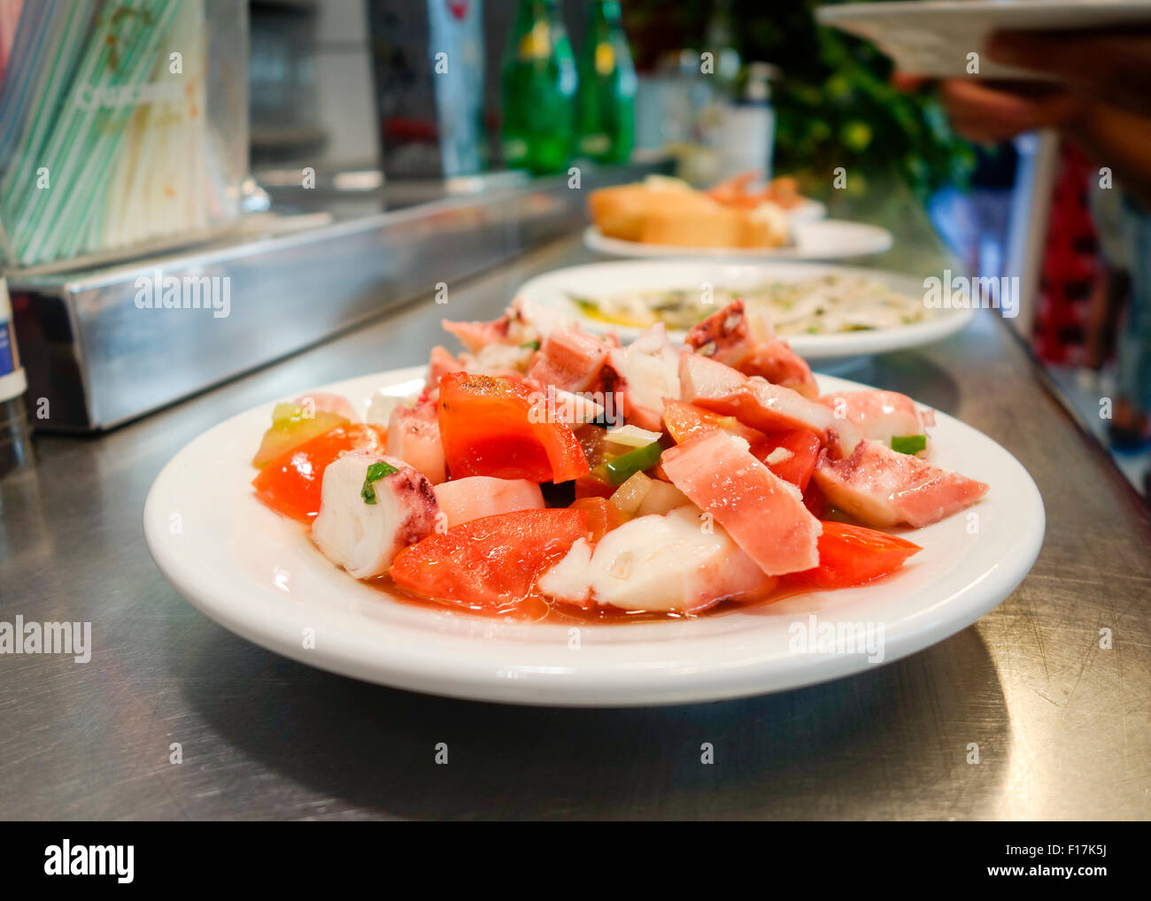 Octopus Salad, Ensalada de pulpo Seafood Salad served on small plate at seafood bar. Spain Stock Photo