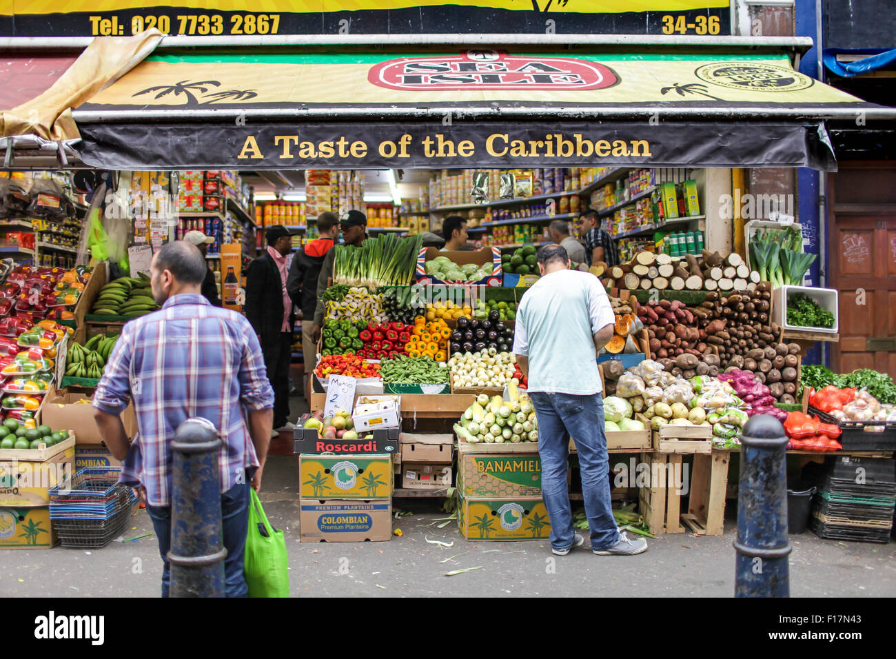 People shop for groceries on Electric Avenue in Brixton. Stock Photo