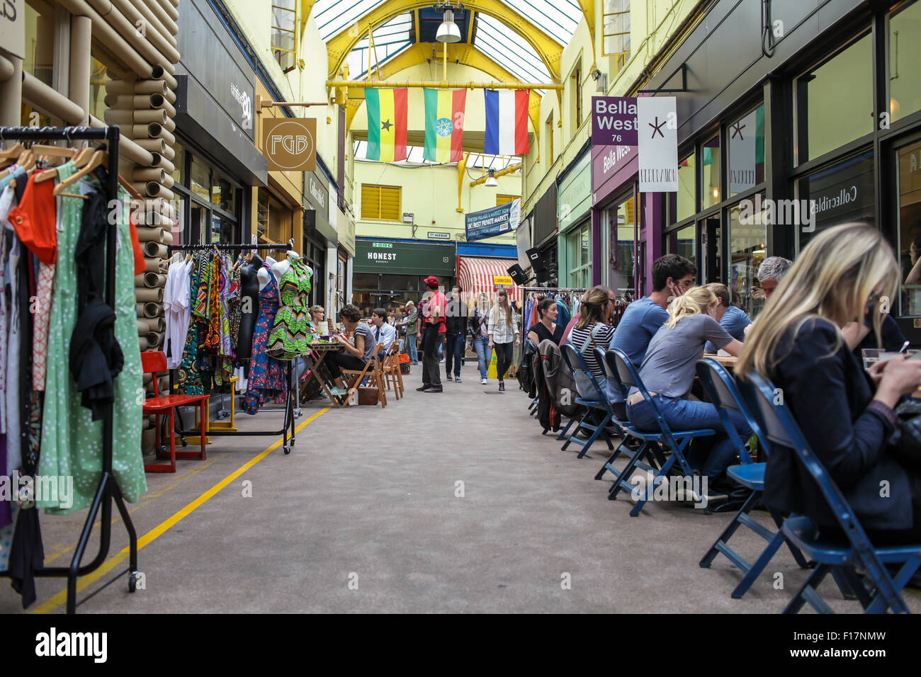 Brixton Village market, London, UK. People enjoy food and drink in