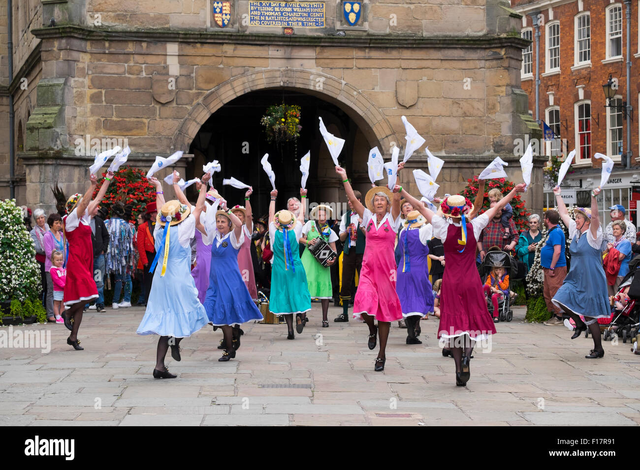 Shrewsbury Morris dance ladies dancing in front of the Old Market Hall during Shrewsbury Folk Festival, Shropshire, England, UK Stock Photo