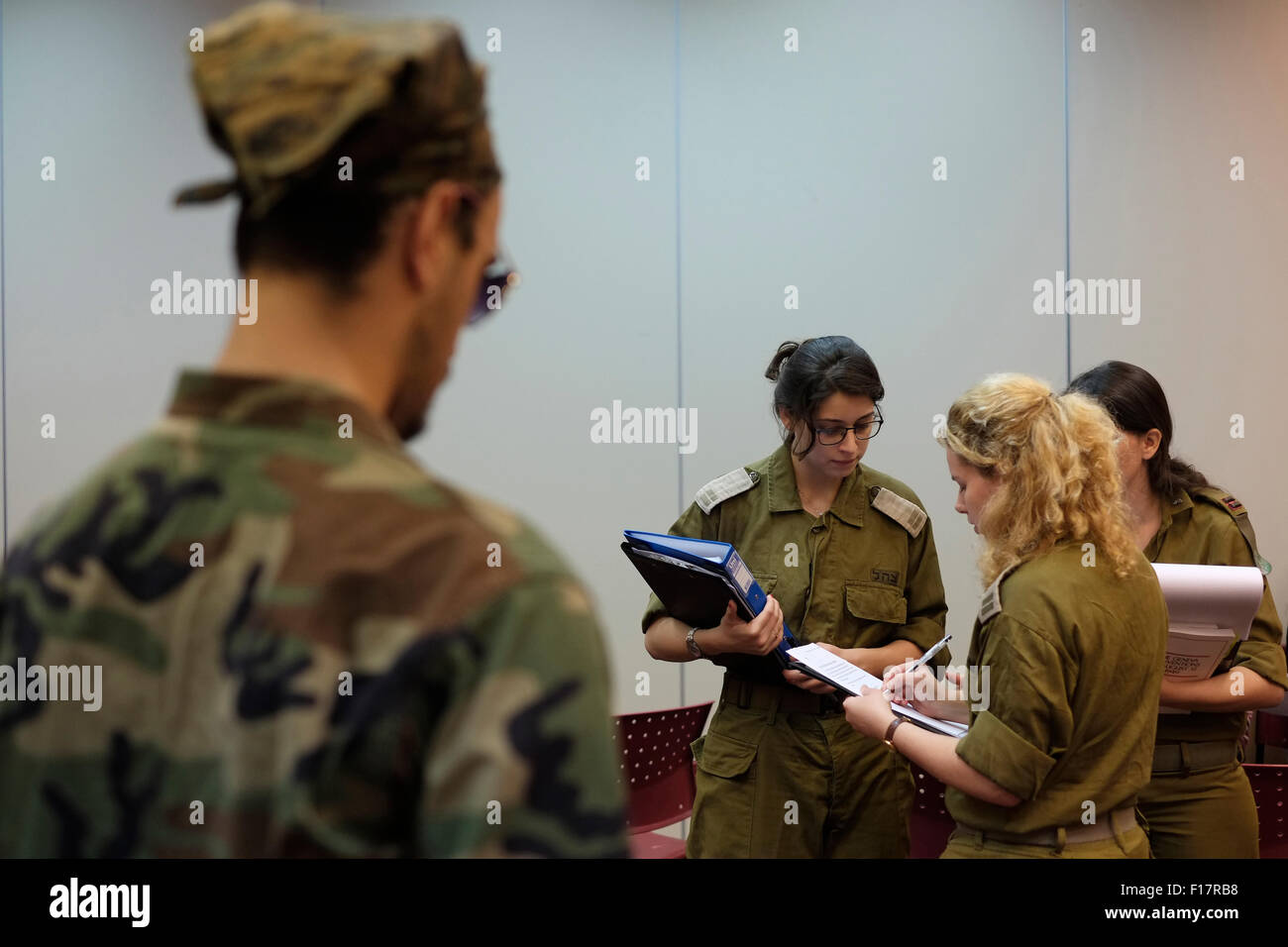 Tzuba, Israel. 19th November, 2014. Israeli students dressed as soldiers taking part in competitive role-playing simulations during IHL International humanitarian law competition in Kibbutz Tzuba Israel On 19 November 2014. The National IHL Competition is a four-day event organized by the International Red Cross in Israel. During the competition, teams of Israeli students participate in several rounds of simulations that not only test their knowledge of international humanitarian law but also their ability to apply it to real-life situations. Stock Photo