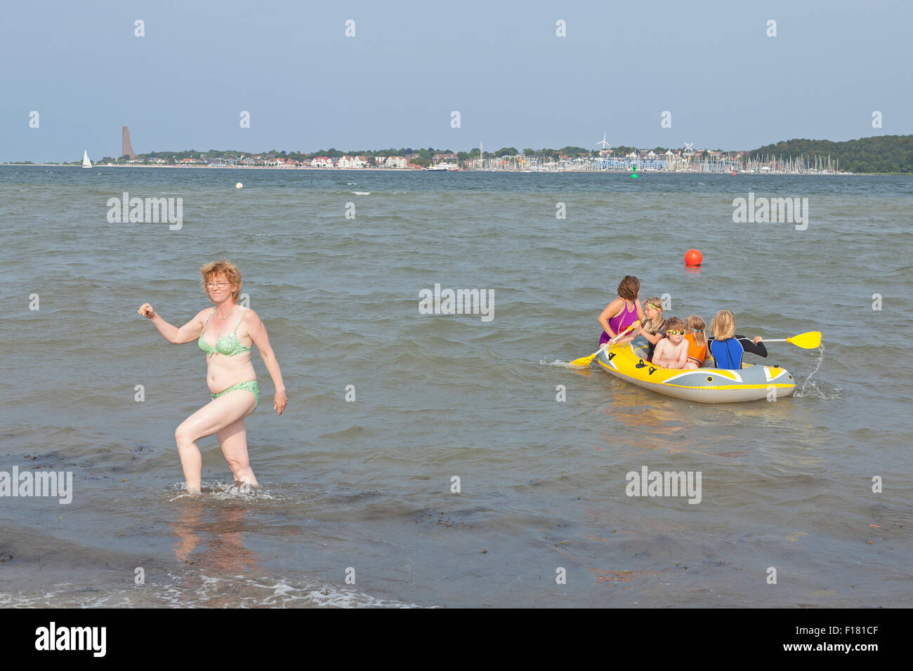 family at the beach, Friedrichsort, in the background Laboe, Kiel, Schleswig-Holstein, Germany Stock Photo