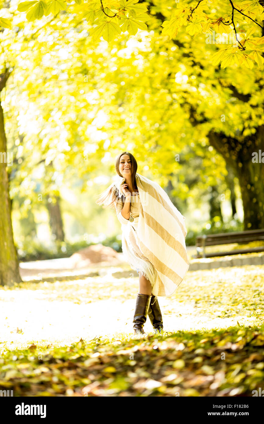 Young woman in autumn forest Stock Photo - Alamy