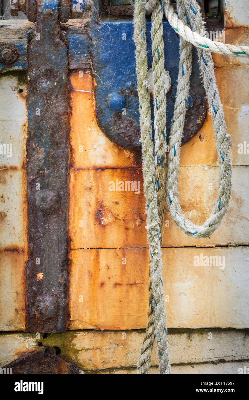 Rope and rust on fishing boat on the dock on the Siuslaw River in Old Town Florence on the central Oregon coast. Stock Photo