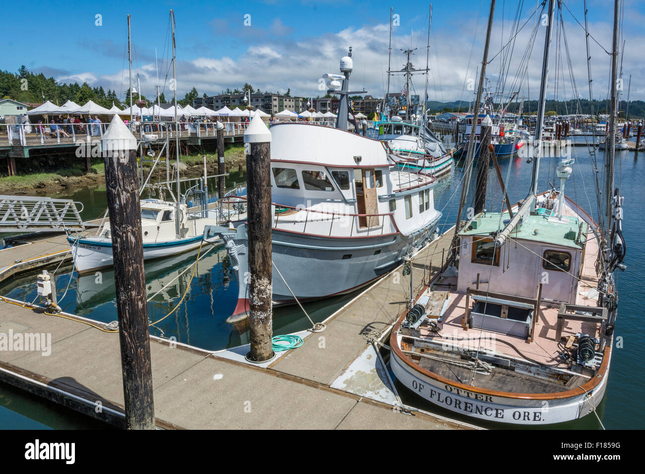 Fishing boats at docks on the Siuslaw River in Old Town Florence on the