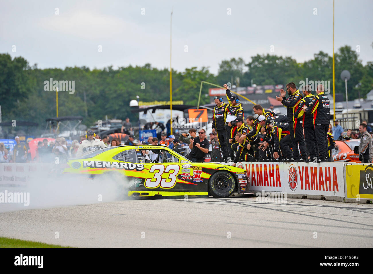 Elkhart Lake, WI, USA. 29th Aug, 2015. Elkhart Lake, WI - Aug 29, 2015: Paul Menard (33) celebrates with a burnout after winning the Road America 180 Fired up by Johnsonville after leading the field through across the finish line in the Richmond/Menards Chevy at Road America in Elkhart Lake, WI. © csm/Alamy Live News Stock Photo