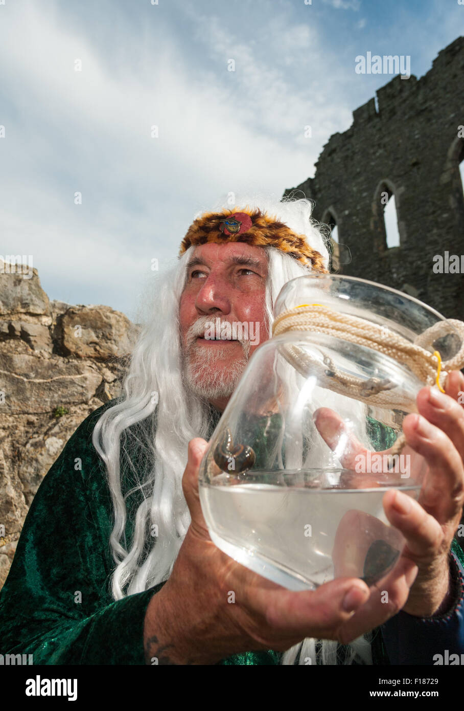 South Wales, UK, Saturday 29 August 2015. The 3rd annual Medieval Fair at Kidwelly Castle, near Llanelli, Carmarthenshire, Wales, UK. Pictured is Bob Edwards, 'Apothecary', with one of the tools of his trade, a leach, at Kidwelly Castle during bank holiday weekend. Credit:  Algis Motuza/Alamy Live News Stock Photo