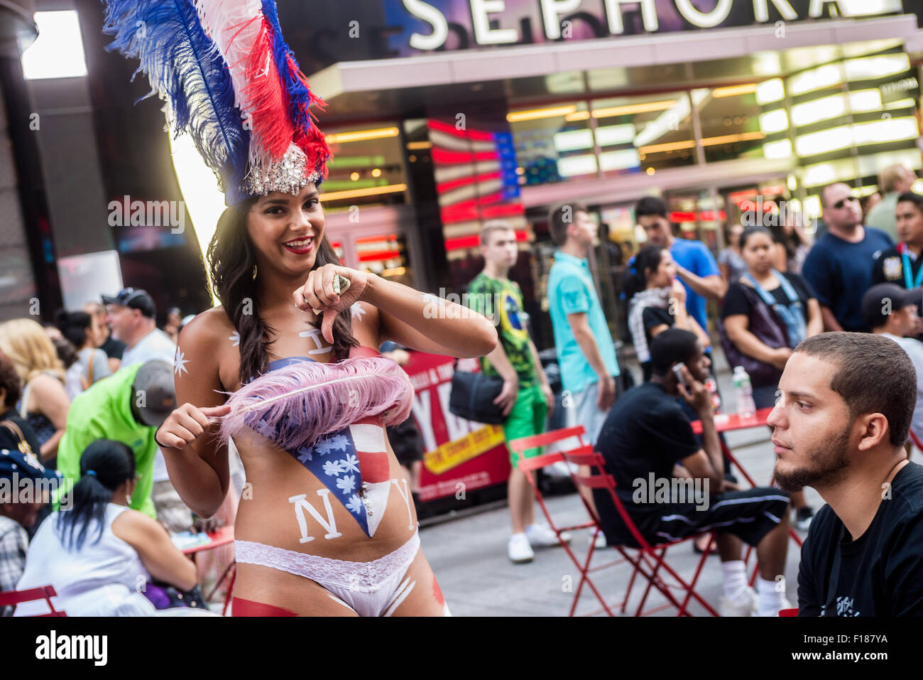 The Desnudas are topless women wearing only panties who paint their exposed  bodies with body paint and stand in Times Square to pose with tourists fo  Stock Photo - Alamy
