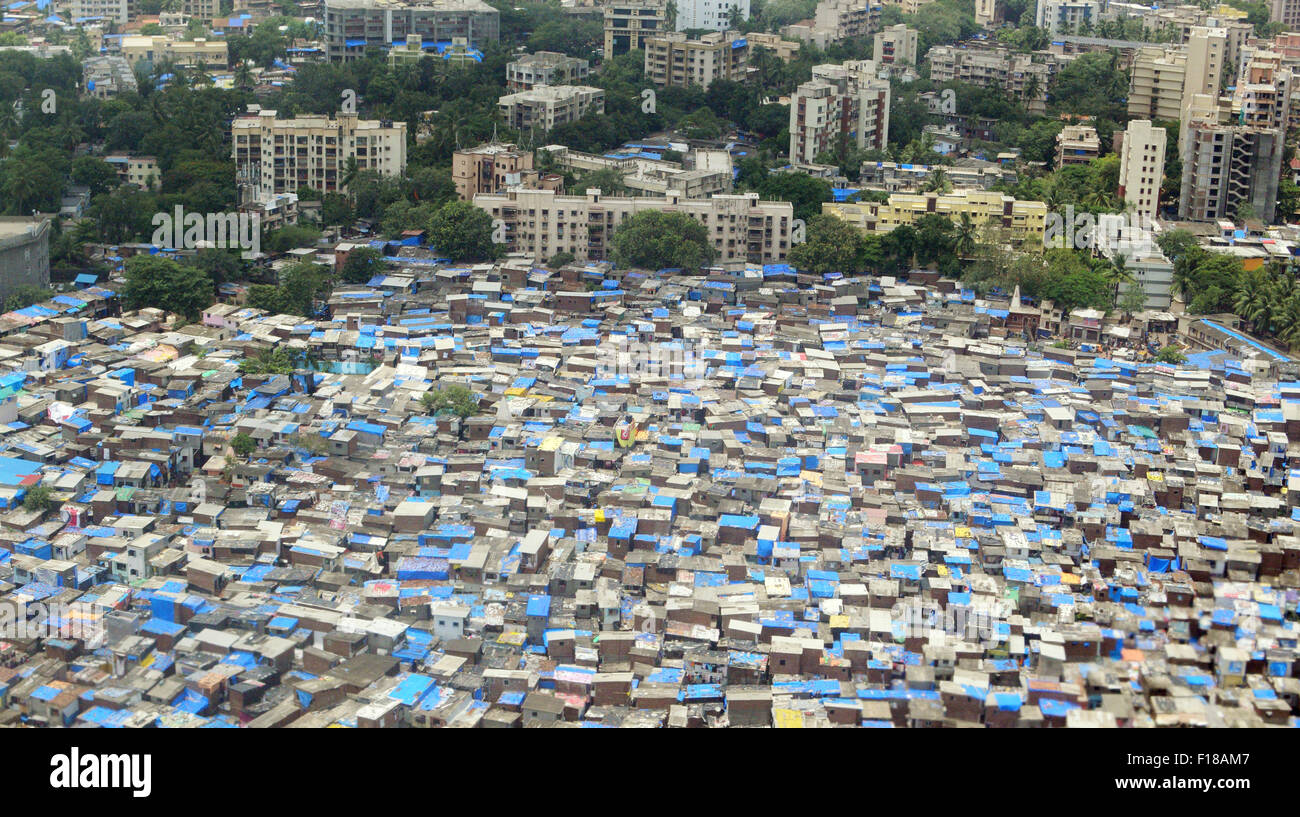 Slums of Mumbai City Mumbai slum Aerial View Showing Rich High rise buildings and Vast Poor India Slum Area Stock Photo