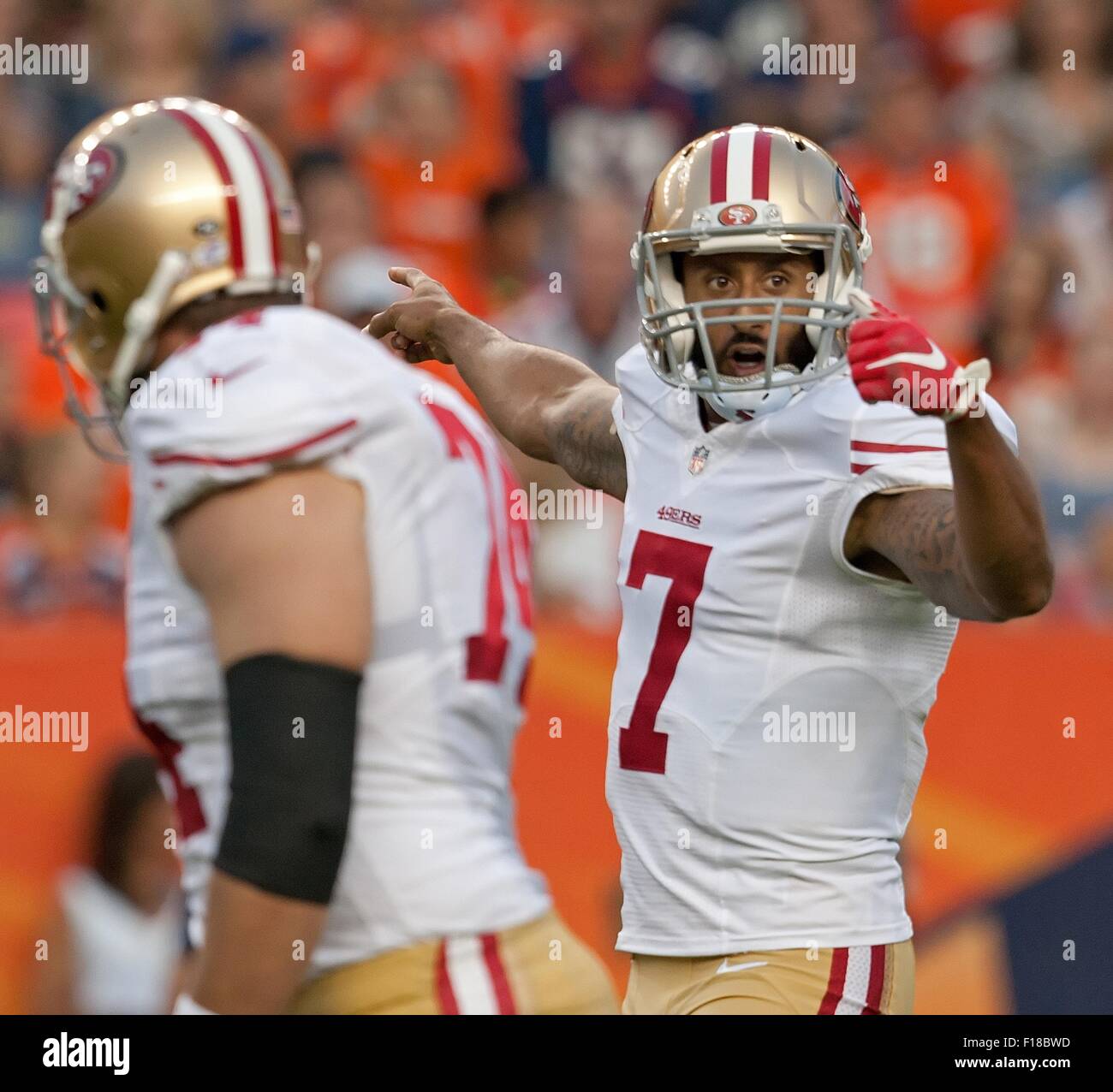 Denver, Colorado, USA. 29th Aug, 2015. San Francisco QB COLIN KAEPERNICK, left, motions for his receiver to get into position on the right side during the 1st. Half at Sports Authority Field at Mile High Saturday night. the Broncos beat the 49ers in Pre-Season play 19-12. Credit:  Hector Acevedo/ZUMA Wire/Alamy Live News Stock Photo