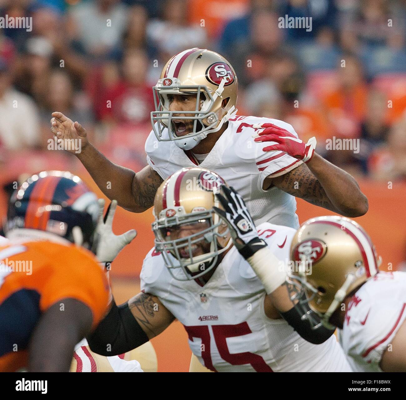 Denver, Colorado, USA. 29th Aug, 2015. San Francisco QB COLIN KAEPERNICK, center, yells at his Offensive Line about a possible Blitz during the 1st. Half at Sports Authority Field at Mile High Saturday night. the Broncos beat the 49ers in Pre-Season play 19-12. Credit:  Hector Acevedo/ZUMA Wire/Alamy Live News Stock Photo