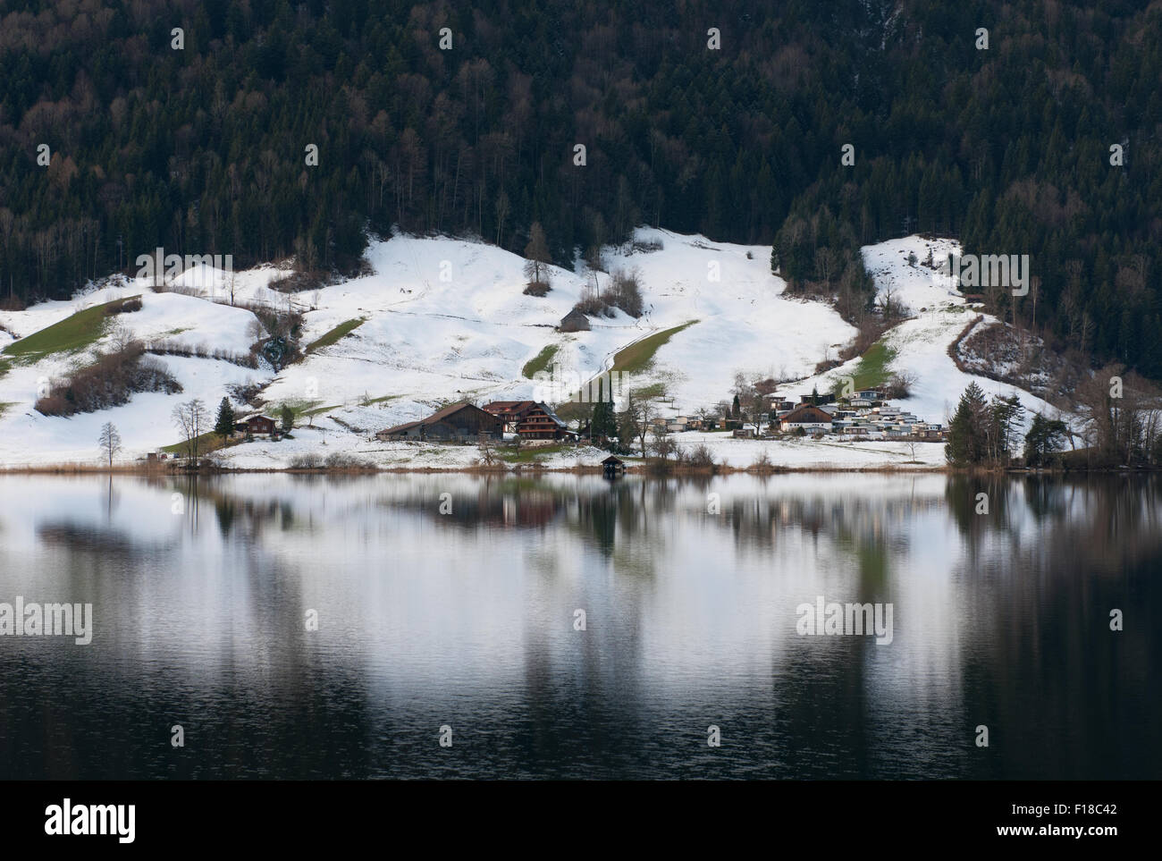 Picturesque reflections in a lake, near Zug, in Switzerland Stock Photo