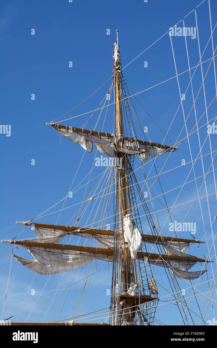 Mast of sail ship in blue sky Stock Photo