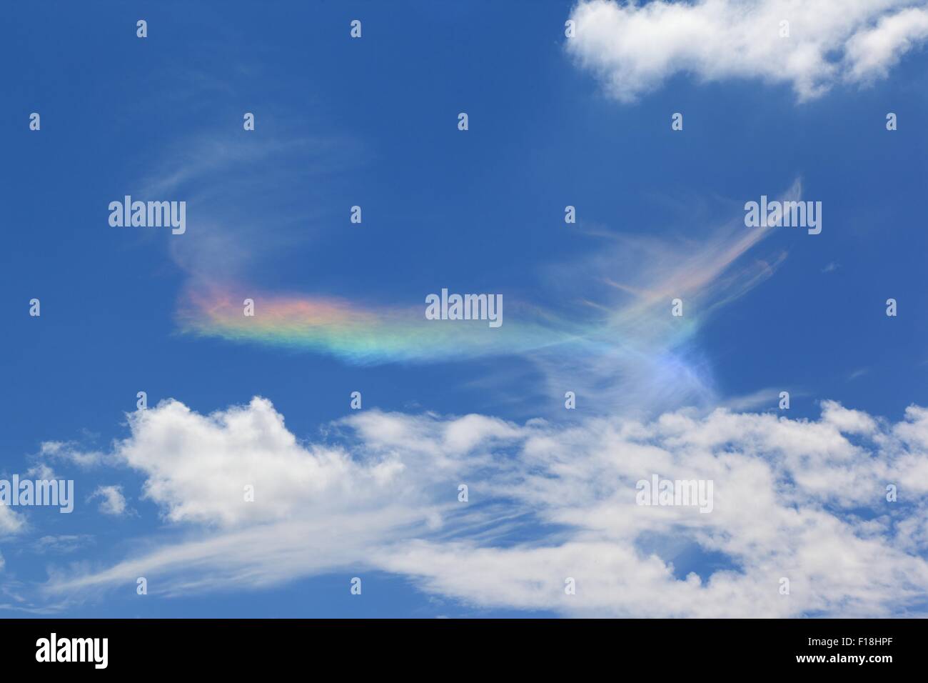 Fire Rainbow in Clouds Stock Photo