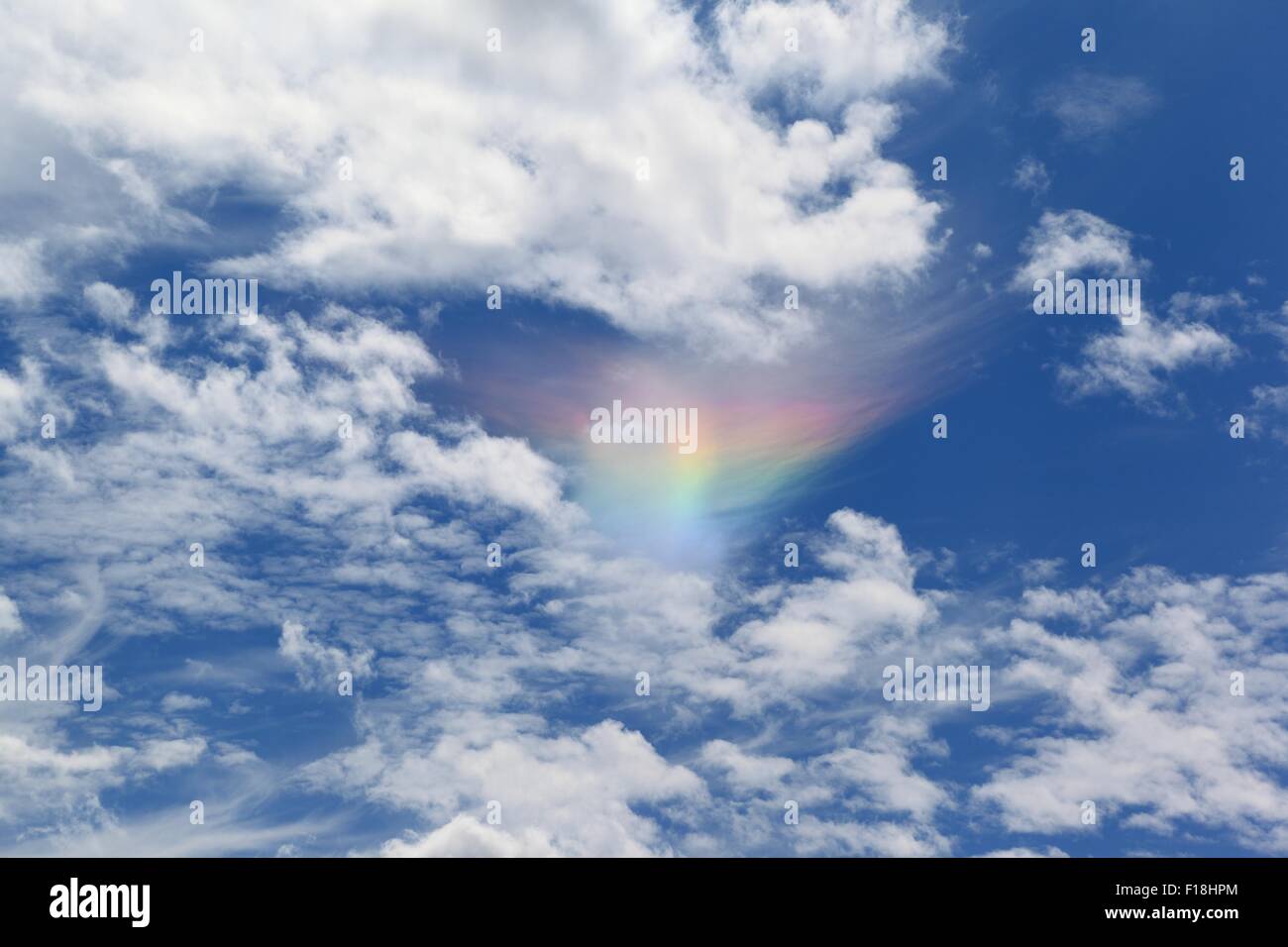 Fire Rainbow in Clouds Stock Photo