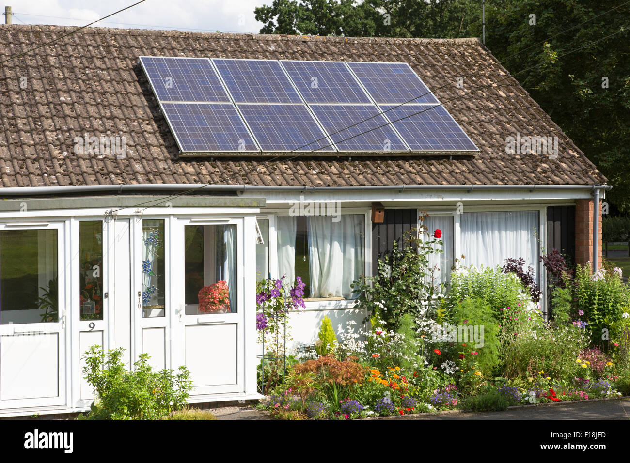 Solar panels on retirement bungalows, England, UK Stock Photo