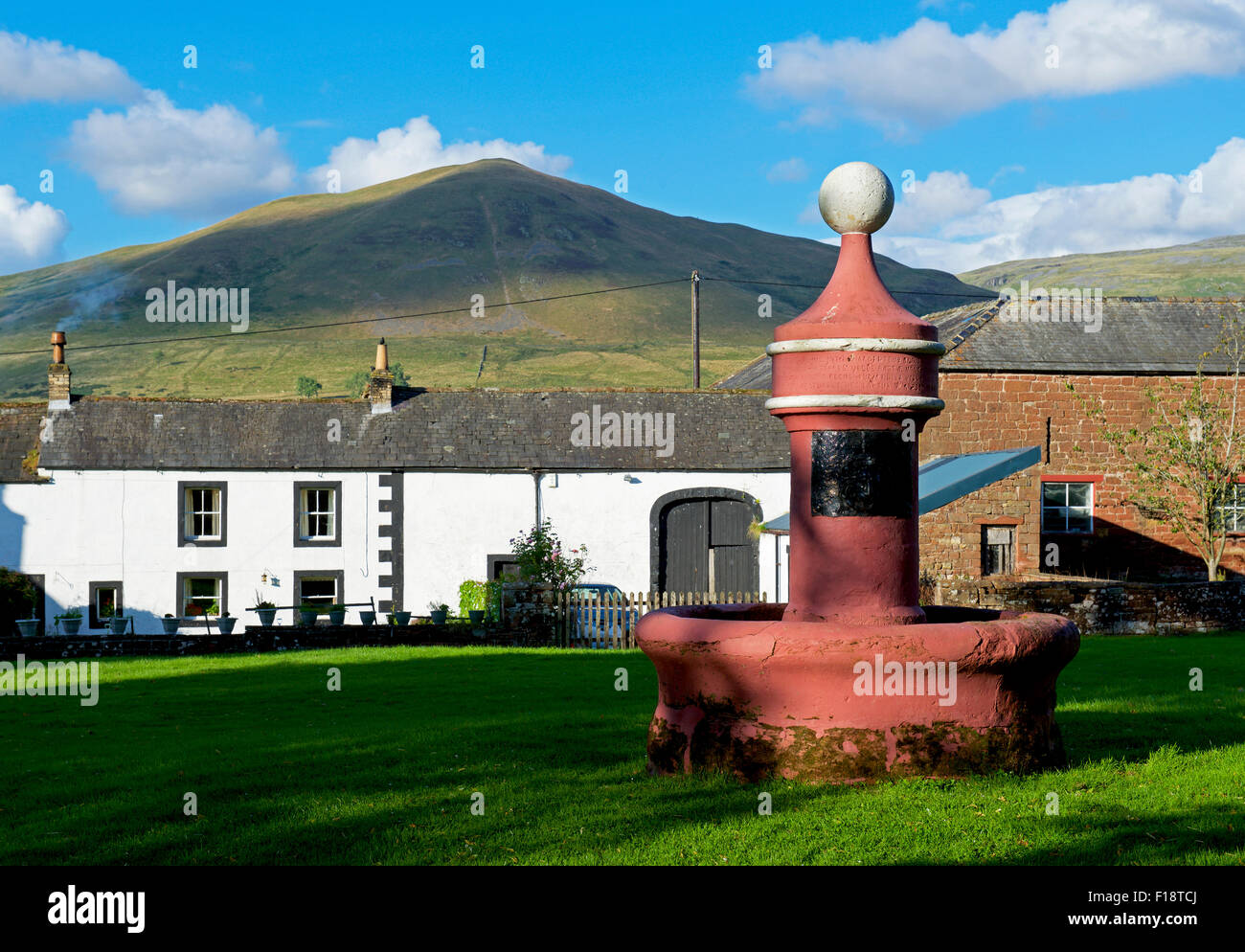 Water fountain on the green in the village of Dufton, with Dufton Pike
