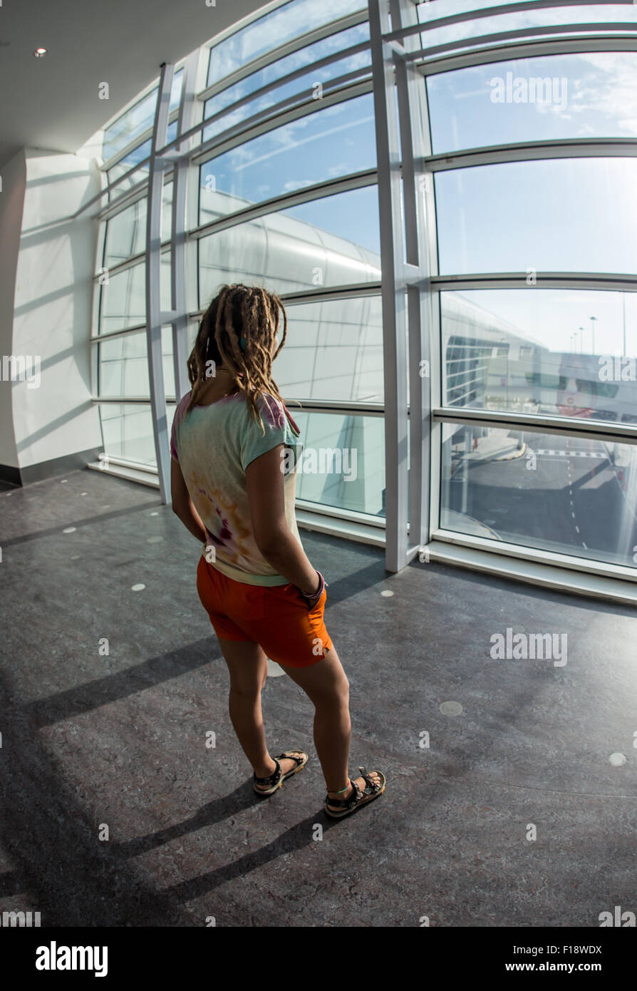 Young woman at international airport Stock Photo - Alamy