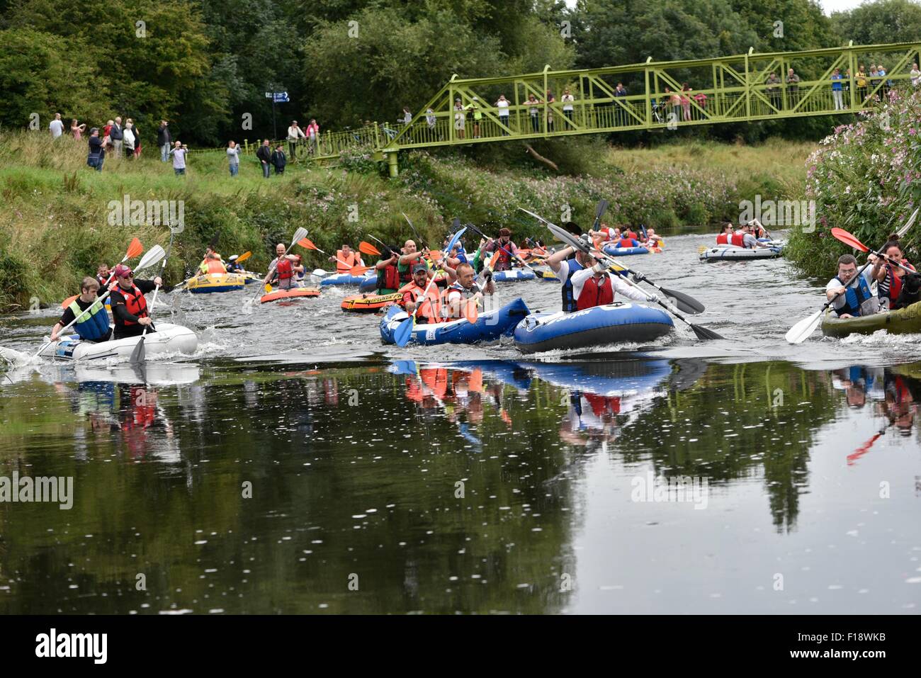 Manchester, UK  30th August 2015 The Annual Northenden Boat Race, started in 2006, goes  about a mile from Simon's Bridge, Didsbury along the River Mersey to Northenden Bridge. This year there are two categories, one for canoes and kayaks, the other for dinghies. A fun event to raise money for The Christie Hospital, it has a competitive edge, with a trophy awarded to the winners of each category. Northenden Boat Race 2015  Manchester, UK Credit:  John Fryer/Alamy Live News Stock Photo